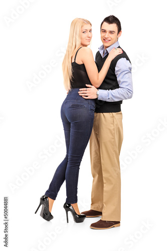 Photo: Full length portrait of a young man and woman in an embrace Full length portrait of a young man and woman in an embrace