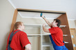 Photo: Wardrobe joiners at installation work Wardrobe joiners at installation work