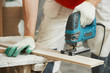Cutting parquet board with jigsaw