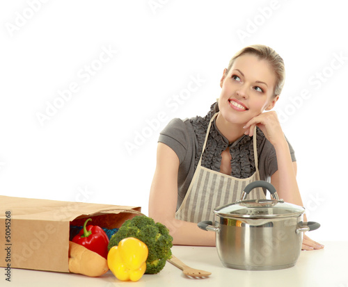 Photo: Woman in apron with grocery bag , isolated on white background Woman in apron with grocery bag , isolated on white background
