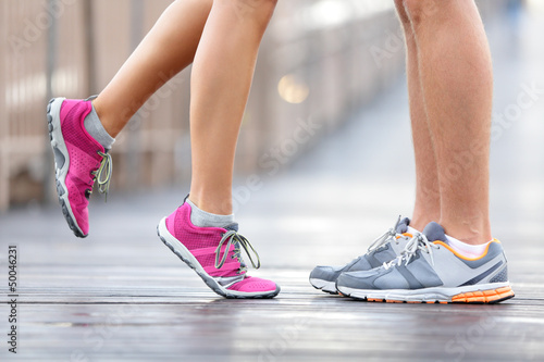 Photo: Love sport concept - running couple kissing Love sport concept - running couple kissing