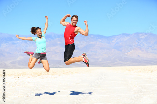 Photo: Success - young runners jumping Success - young runners jumping