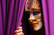 Foto: woman in violet carnival mask woman in violet carnival mask