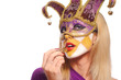 woman in violet carnival mask