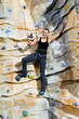Photo: woman on rock wall woman on rock wall