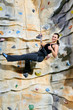 woman on rock wall