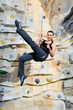 Photo: woman on rock wall woman on rock wall