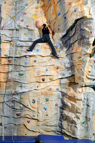 Photo: woman on rock wall woman on rock wall