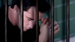 Man sitting in jail