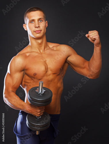 Photo: Athlete is demonstrating his well trained body Athlete is demonstrating his well trained body