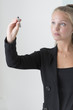 Young attractive businesswoman draw with digital pen