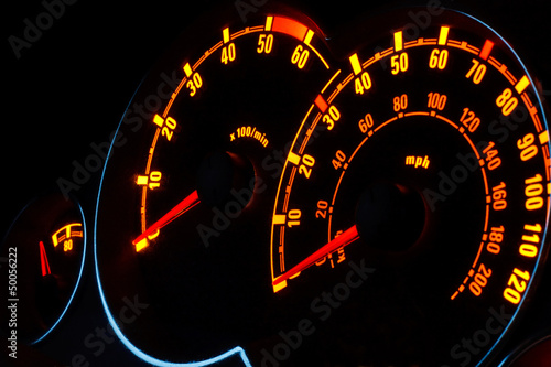 Photo: Backlit car dashboard dials glowing at night Backlit car dashboard dials glowing at night