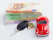 Car with car key and stacked money to show the cost increase