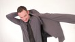 Young businessman puts on his suit jacket