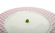 Plate with peas white isolated