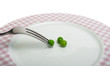 Plate with peas and centimeter measure