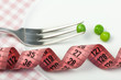 Plate with peas and centimeter measure