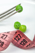 Plate with peas and centimeter measure
