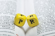 Word PR.Wooden cubes on magazine