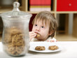 Photo: Little boy eating cookies Little boy eating cookies
