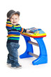 little boy and the keyboard on white background. funny boy baby.