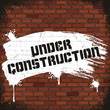 Under Construction Sign, Painted on Old Brick Wall