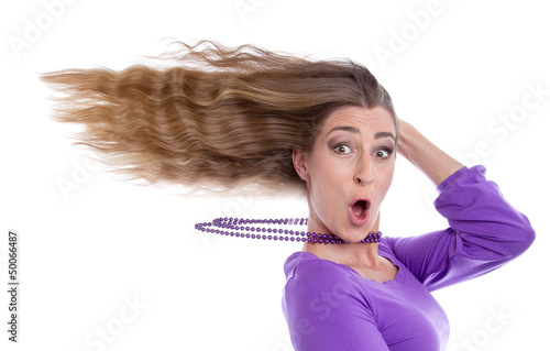 Photo: Partystimmung - Frau mit verwehtem Haar isoliert in Violett Partystimmung - Frau mit verwehtem Haar isoliert in Violett