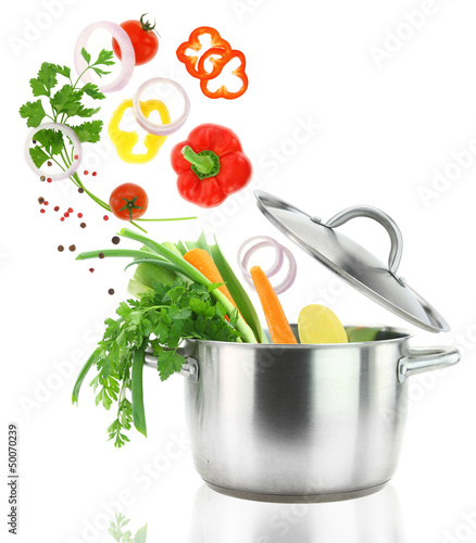 Photo: Fresh vegetables falling into a stainless steel casserole pot Fresh vegetables falling into a stainless steel casserole pot