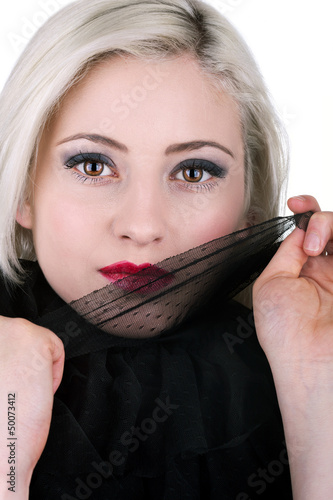 Photo: A beautiful young woman playing with lace A beautiful young woman playing with lace