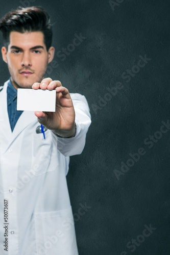 Photo: Doctor offering us his business card Doctor offering us his business card