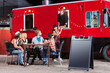 Chef Serves Pizza from Food Truck