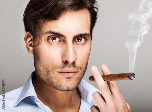 Photo: Man smiking a cigar Man smiking a cigar