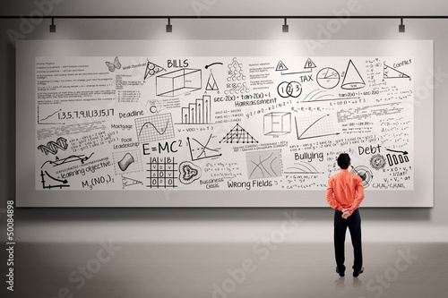 Photo: Businessman looking at billboard Businessman looking at billboard
