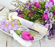 Romantic place setting with tulips and freesia for lovers