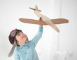 Photo: happy boy play in airplane indoors happy boy play in airplane indoors