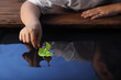 green leaf-ship in children hand