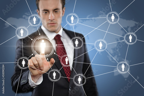 Photo: Man touching display Network Man touching display Network