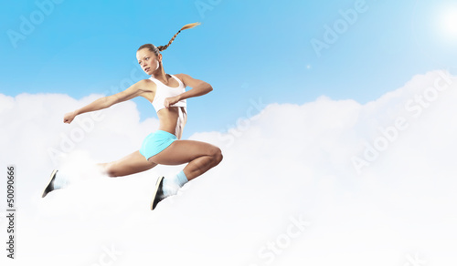 Photo: Image of sport woman jumping Image of sport woman jumping