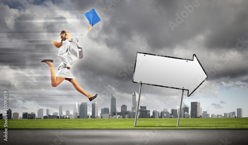 Photo: Businesswoman running on the road Businesswoman running on the road