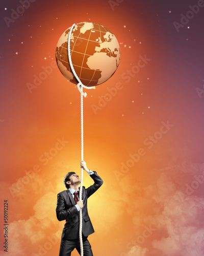 Photo: Image of businessman climbing rope Image of businessman climbing rope