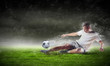 football player striking the ball