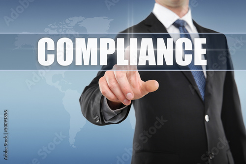 Photo: Man touching display Compliance Man touching display Compliance