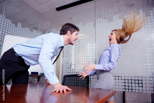 Photo: Angry busines sman screaming at employee Angry busines sman screaming at employee