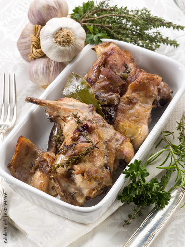 Photo: roasted rabbit with herbs and garlic roasted rabbit with herbs and garlic