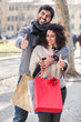 Happy Young Couple with Shopping Bags