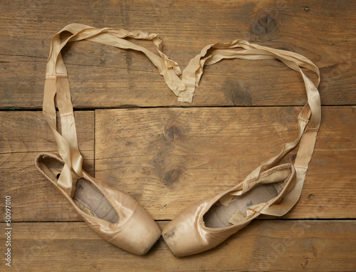 Photo: Pair of Ballet Shoes on Wooden Floor Pair of Ballet Shoes on Wooden Floor