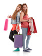 Photo: Two girls with shopping bags. Isolated over white background. Two girls with shopping bags. Isolated over white background.