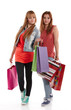Photo: Two girls with shopping bags. Isolated over white background. Two girls with shopping bags. Isolated over white background.