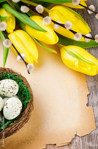 Photo: Easter frame with tulips and vintage paper Easter frame with tulips and vintage paper
