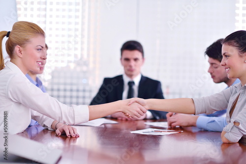 Photo: business people making a deal at meeting business people making a deal at meeting